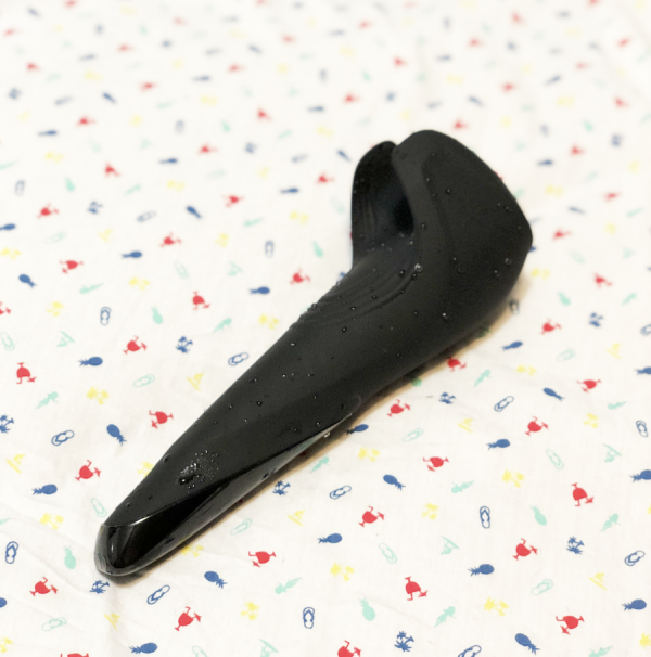 Yet another pic of black silicone beaded with water Satisfyer Wand lying on tropical print fabric